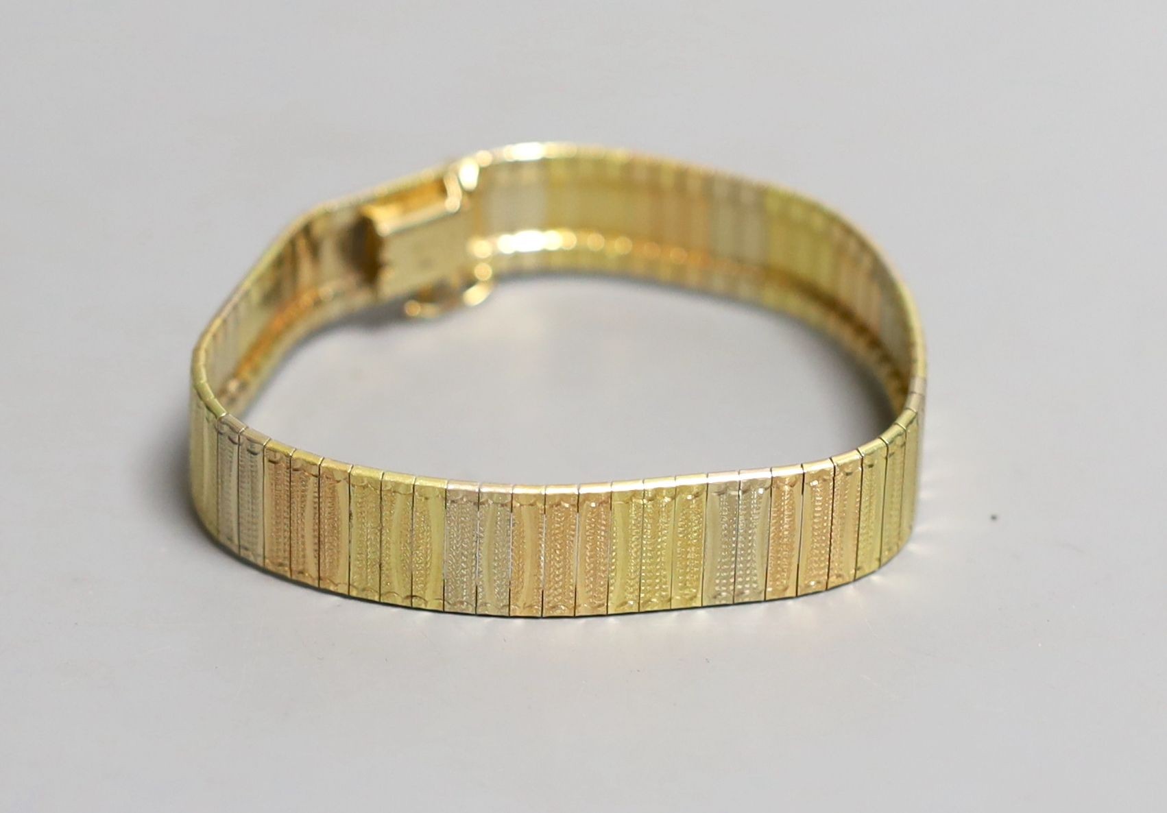 A modern Italian three colour 18ct gold bracelet, 19cm
